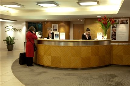 Ramada Hotel & Suites London Docklands - 24 hour reception desk with business services and concierge service